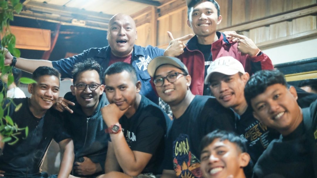 a group of men posing for a picture together